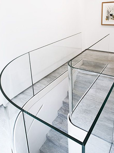 Curved glass stair railing